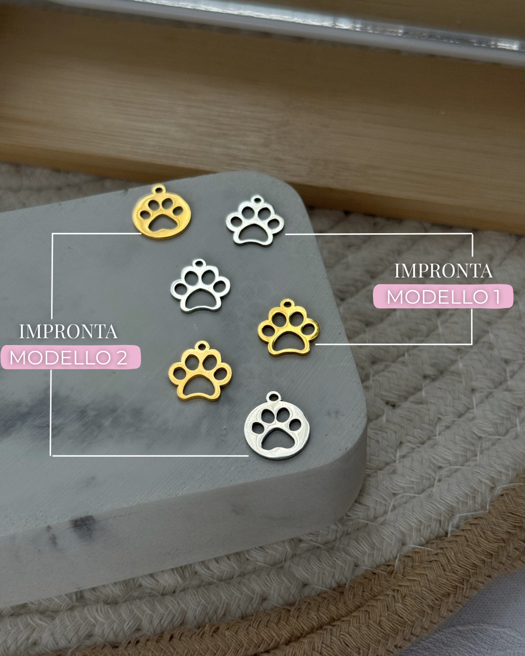 Ciondolo zampa con cerchio in acciaio inox.